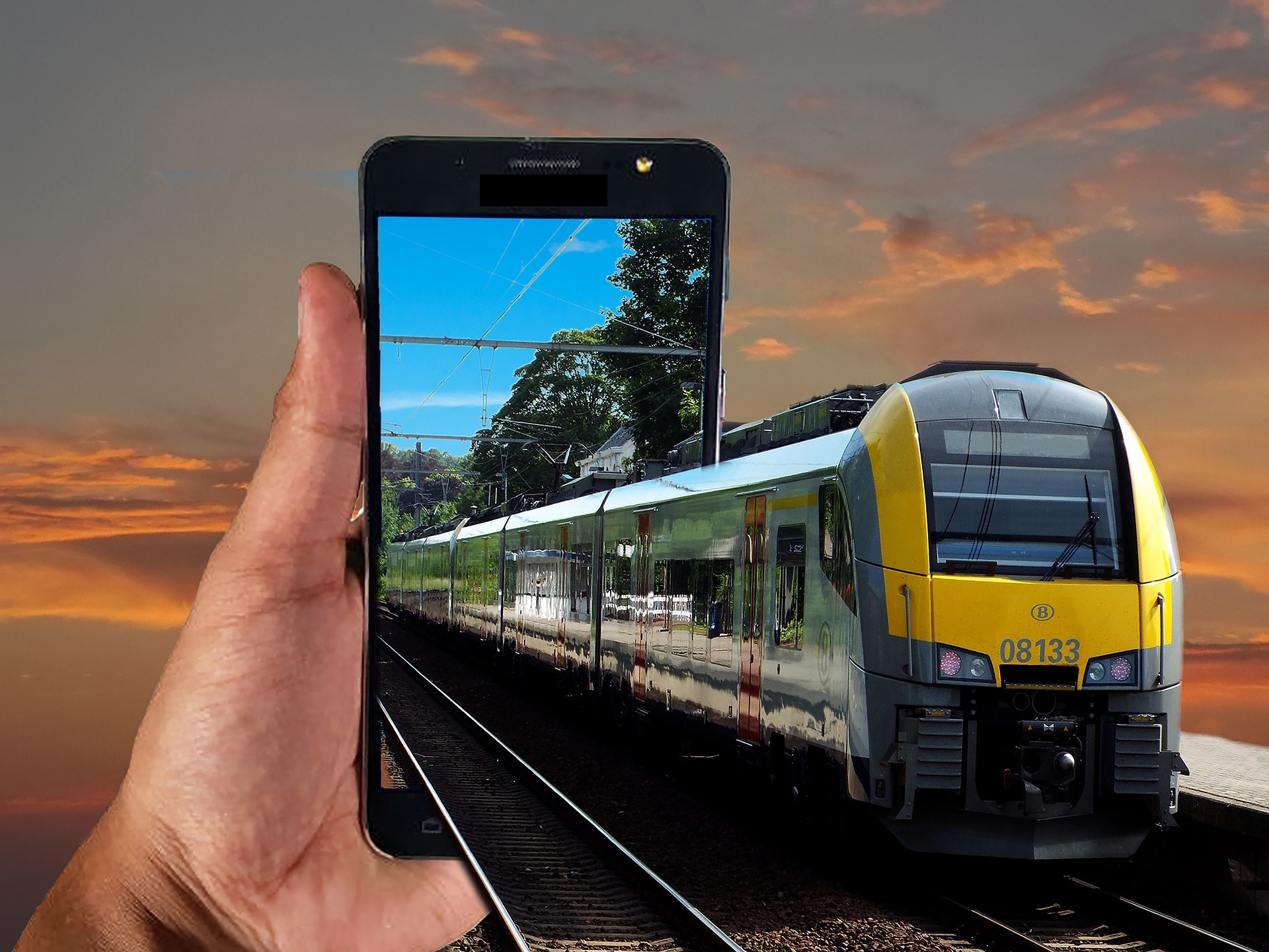 NMBS-trein komt uit smartphone-scherm - Le train NMBS sort de l'écran du smartphone
